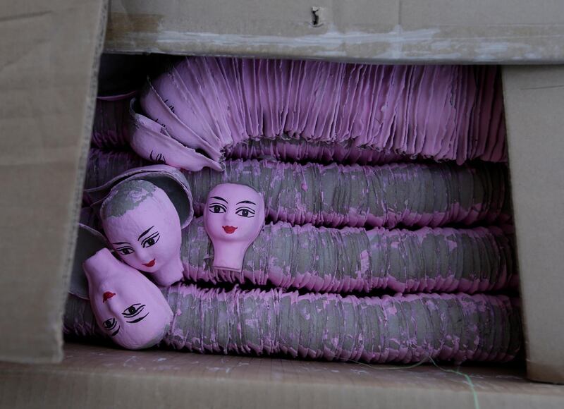 Offerings are seen in a box at a wholesale market where supplies for ceremonial rites for the dead are sold, in Mibeizhuang, China. Reuters