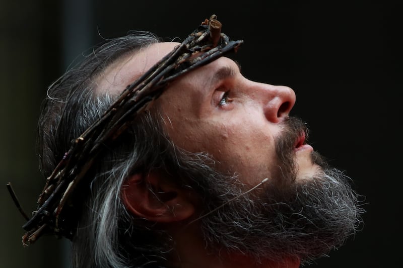 Rafael Haddad dressed as Jesus Christ at Martin Place during a Good Friday street theatre performance by Wesley Mission in Sydney, Australia. Getty Images