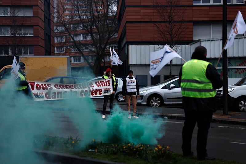 Police officers protest outside the police station in Roubaix. AFP