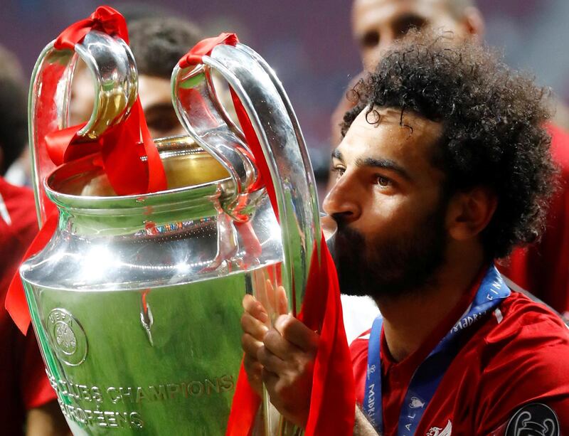 Soccer Football - Champions League Final - Tottenham Hotspur v Liverpool - Wanda Metropolitano, Madrid, Spain - June 1, 2019  Liverpool's Mohamed Salah kisses the trophy as he celebrates after winning the Champions League  REUTERS/Kai Pfaffenbach     TPX IMAGES OF THE DAY