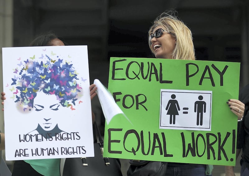 FORT LAUDERDALE, FL - MARCH 14:  Elana Goodman joins with other protesters to ask that woman be given the chance to have equal pay as their male co-workers on March 14, 2017 in Fort Lauderdale, Florida. The protest was held as the legislation in the state of Florida looks at passing the Helen Gordon Davis fair pay protection act that would strengthen state laws in terms of equal pay.  (Photo by Joe Raedle/Getty Images)