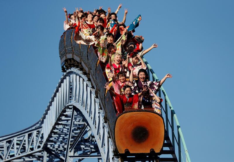 Japanese women wearing kimonos ride a roller coaster during their Coming of Age Day celebration ceremony at Toshimaen amusement park in Tokyo. Reuters