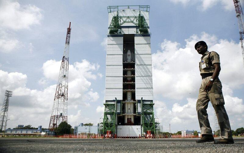 A paramilitary soldier walks past the Polar Satellite Launch Vehicle (PSLV-C25) at the Satish Dhawan Space Center at Sriharikota, in the southern Indian state of Andhra Pradesh. AP