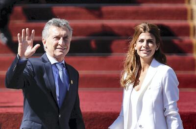 Argentine President Mauricio Macri (L) and First Lady Juliana Awada arrive at the Congress in Valparaiso, Chile, for the inauguration of Chile's new president Sebastian Pinera, on March 11, 2018. / AFP PHOTO / PABLO VERA LISPERGUER