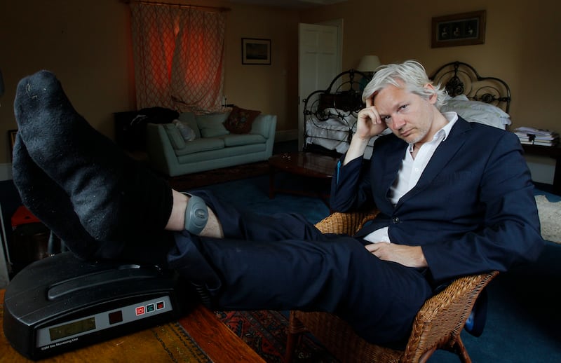 Wearing an ankle tag, Mr Assange at the house where he was required to stay in Suffolk, England, in June 2011. AP Photo