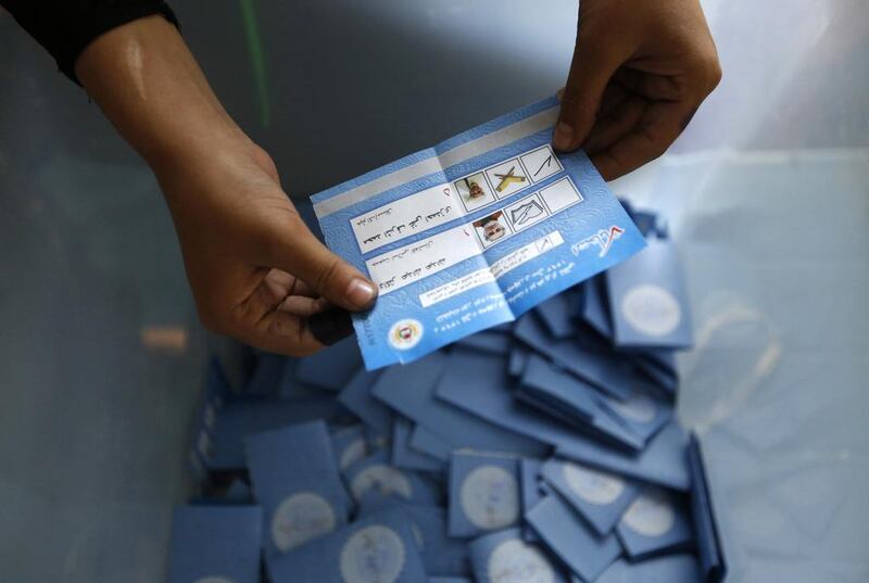 An election official counts ballot papers after voting closed at a polling station in Kabul on June 14, 2014. Mohammad Ismail / Reuters