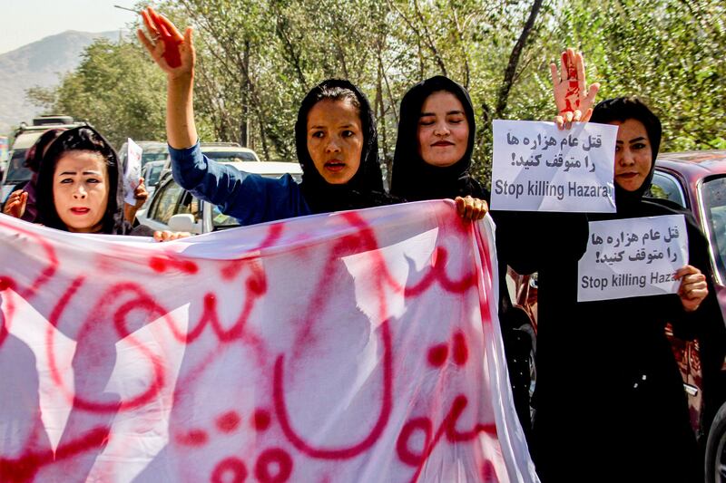 Protesters later gathered in front of the hospital and chanted slogans as dozens of heavily armed Taliban, some carrying rocket-propelled-grenade launchers, kept watch.