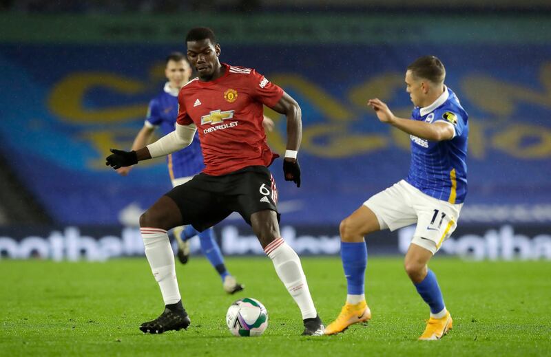 Manchester United's Paul Pogba (left) and Brighton and Hove Albion's Leandro Trossard battle for the ball during the Carabao Cup fourth round match at the AMEX Stadium, Brighton. PA Photo. Picture date: Wednesday September 30, 2020. See PA story SOCCER Brighton. Photo credit should read: Matt Dunham/NMC Pool/PA Wire. EDITORIAL USE ONLY No use with unauthorised audio, video, data, fixture lists, club/league logos or "live" services. Online in-match use limited to 120 images, no video emulation. No use in betting, games or single club/league/player publications.