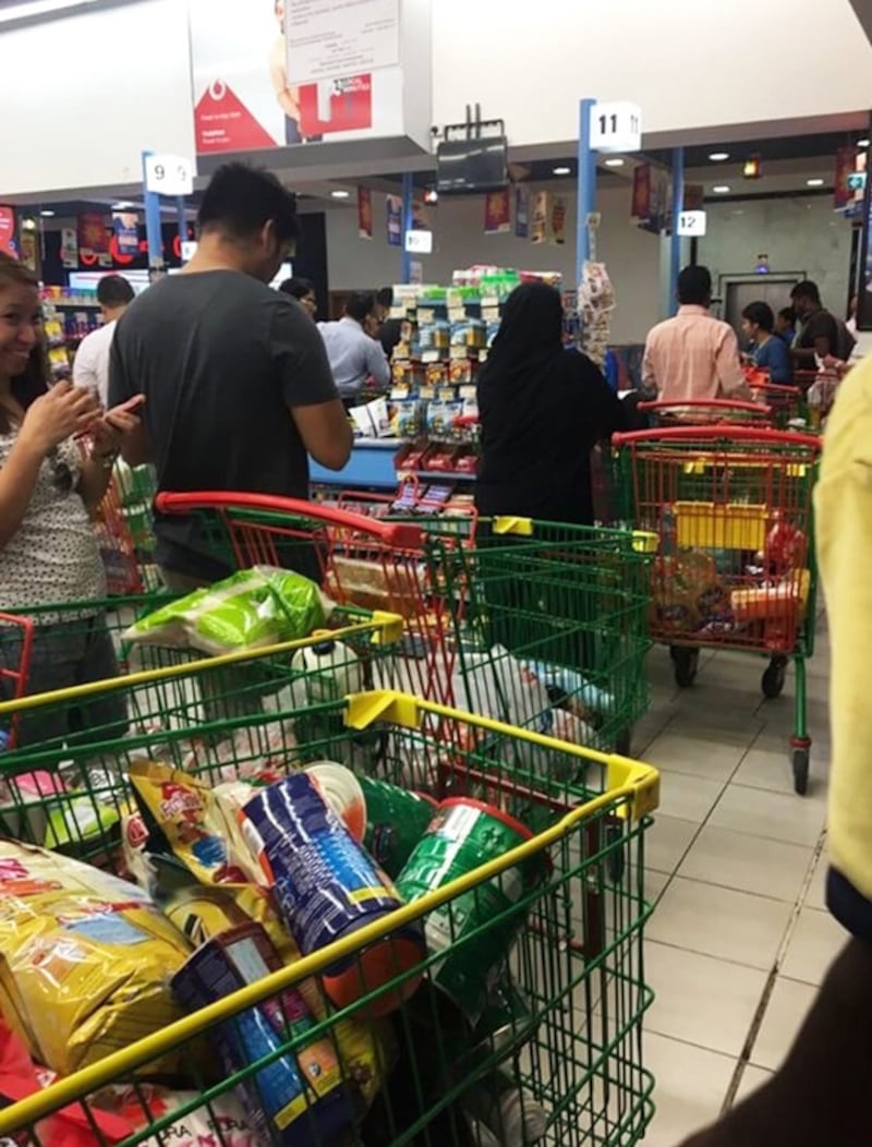 People rushing to buy food supplies at a supermarket in Doha, Qatar on June 5, 2017. Arab nations including the UAE and Saudi Arabia cut diplomatic ties with Qatar, further deepening a rift between Gulf Arab nations over Doha's support for Islamist groups. @shalome05 via AP