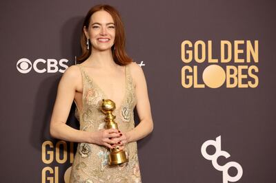 Emma Stone with the award for Best Performance by a Female Actor in a Motion Picture - Musical or Comedy for Poor Things. Reuters 
