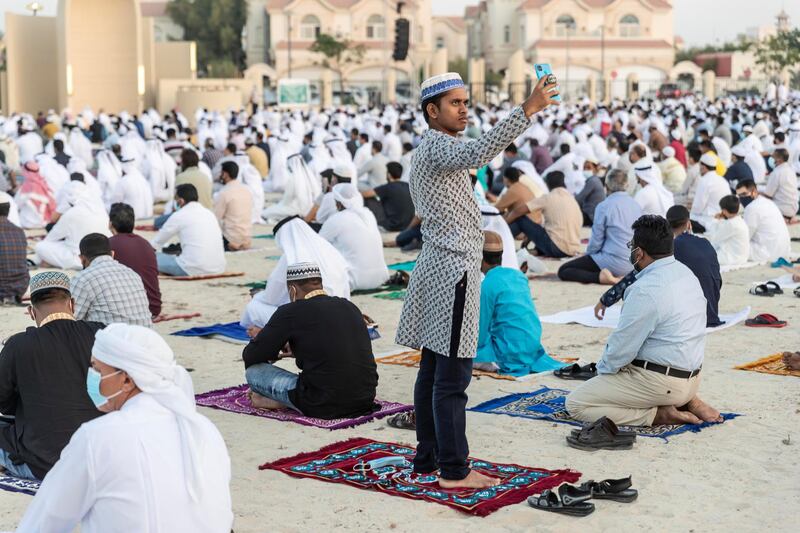 Eid prayers, also known as Salat al-Eid and Șālat al-'Īdayn, is the special prayers (salah) offered to celebrate the Islamic festival at the end of the Holy Month of Ramadan. Traditionally it is held in an open space, Eidgah, such as an allocated spcae or field specifically available for prayer. The UAE Authorities allowed communal Eid prayers again this year with a strict policy of social distancing anf a 15 minite prayer access throughout the UAE after last years locdown due to the Covid - 19 pandemic. Worshippers arrive in preparation for the Eid Prayer at the Umm Suquim Eid prayer grounds on May 13 th, 2021. 
Antonie Robertson / The National.
Reporter: None for National.