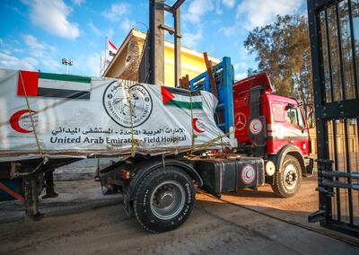 UAE lorries carrying humanitarian aid enter the Rafah border crossing between Egypt and Gaza on Monday. Optimism over the aid access has been tempered by renewed threats of an Israeli ground invasion of Rafah. Victor Besa / The National