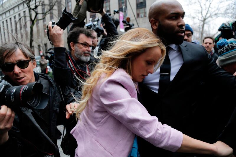 Porn actress Stormy Daniels arrives at federal court, Monday, April 16, 2018, in New York. A U.S. judge will hear more arguments about President Donald Trump's extraordinary request that he be allowed to review records seized from his lawyer, Michael Cohen, office as part of a criminal investigation before they are examined by prosecutors. The raid carried out last Monday at Cohen's apartment, hotel room, office and safety deposit box sought bank records, records on Cohen's dealing in the taxi industry, Cohen's communications with the Trump campaign and information on payments made in 2016 to former Playboy model Karen McDougal and to Daniels. (AP Photo/Seth Wenig)