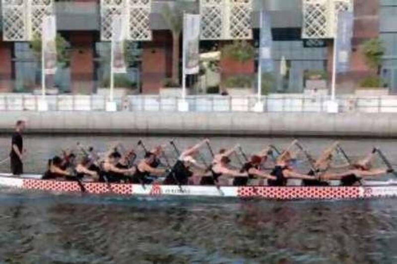 This handout image shows The Dubai Flying Dragons mixed team practising at Dubai festival city for the World Dragon boat championships in Malaysia. 