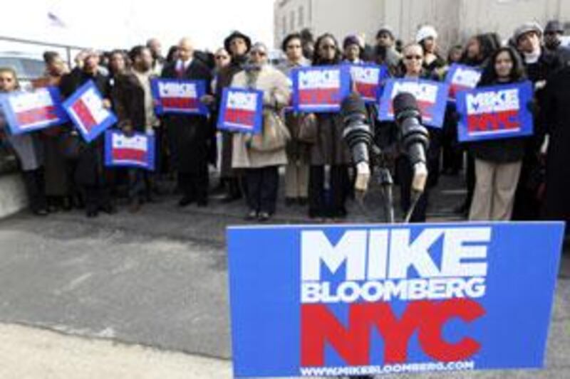 Supporters if Michael Bloomberg wait for him to arrive at a campaign stop in New York.