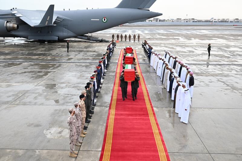 The bodies of three of the Emirati armed forces officers killed in a terrorist attack in Somalia arrive at Al Bateen Airport. A fourth officer died of his injuries after being flown back to the UAE. Wam