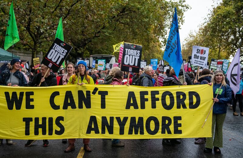 A protest against austerity in London. The average monthly mortgage payment will reach £1,000 ($1,228) next year, the Bank of England said. Bloomberg