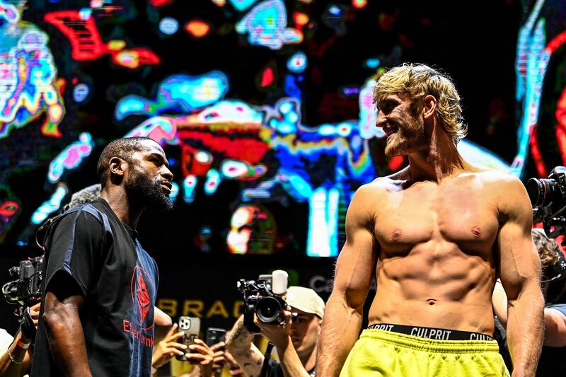 Floyd Mayweather and Logan Paul face off during their weigh-in in Miami. AFP