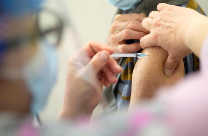 FILE PHOTO: A senior receives the vaccine against the coronavirus disease (COVID-19) as Quebec begins vaccinations for seniors over 85 years old in a clinic in Laval, Quebec, Canada February 25, 2021. REUTERS/Christinne Muschi/File Photo