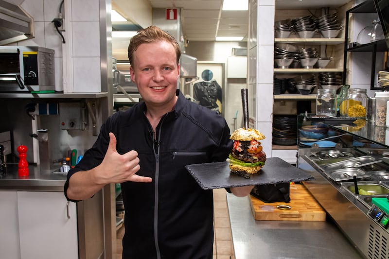 Dutch restaurant owner Robbert Jan de Veen with The Golden Boy burger. Courtesy De Daltons
