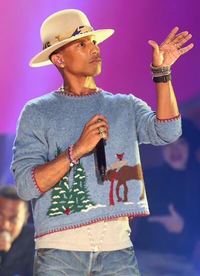 LOS ANGELES, CA - NOVEMBER 18:  Musician Pharrell Williams performs onstage during A VERY GRAMMY CHRISTMAS at The Shrine Auditorium on November 18, 2014 in Los Angeles, California.  (Photo by Frederick M. Brown/Getty Images)