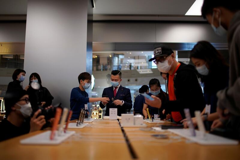 People look at Apple products at an Apple Store in Shanghai, China. Reuters