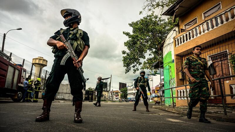 Sri Lankan security forces enforce a cordon while a bomb disposal unit works near the St Anthony Church, April 22, 2019. Jack Moore / The National. 