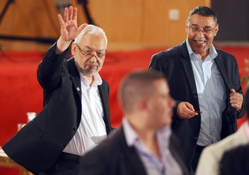 Ennahda party’s leader, Rached Ghannouchi, waves as he arrives for Saturday’s talks between Tunisia’s Islamists and the opposition. AFP