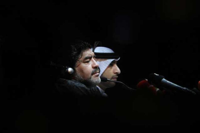 Tough questions to answer: Maradona (L) is seen with Marwan Bin Bayat (R) Chairman of Al Wasl Football Company during a press conference. EPA / Ali Haider