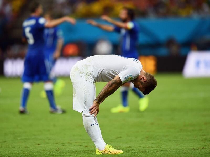 Jack Wilshere hangs his head in dejection after England lose 2-1 to Italy in their Group D opener at the 2014 World Cup on Saturday. Christopher Lee / Getty Images