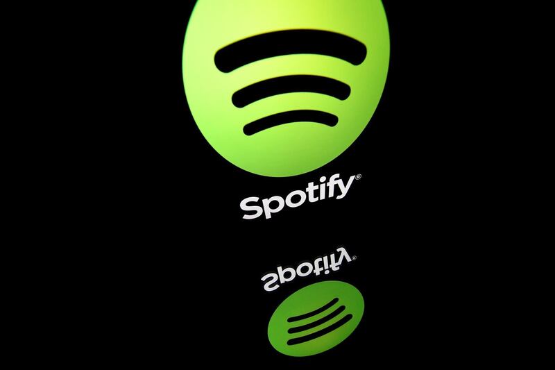 (FILES) In this file photo illustration taken on April 19, 2018 shows the logo of online streaming music service Spotify displayed on a tablet screen in Paris.  Spotify has stealthily released an option to mute certain artists on its mobile app, a much-requested feature that comes amid calls to remove music from artists like R. Kelly over abuse allegations. The new button, first reported by tech news site Thurrott, allows users of the streaming service to prevent any artist from automatically playing by selecting "Don't play this artist" from a menu on the artist's page. The Sweden-based music company removed several artists including Kelly from its curated playlists last year, as outrage grew over sexual assault allegations against the R&B star, spawning the #MuteRKelly movement.
 / AFP / Lionel BONAVENTURE / TO GO WITH AFP STORY  - "Spotify releases feature to block specific artists"
