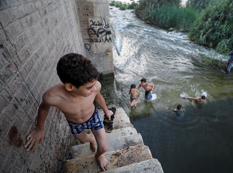A boy swims in the Nile River during hot weather on the outskirts of Cairo. Reuters