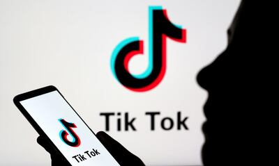 FILE PHOTO: A person holds a smartphone with Tik Tok logo displayed in this picture illustration taken November 7, 2019. Picture taken November 7, 2019. REUTERS/Dado Ruvic/Illustration/File Photo