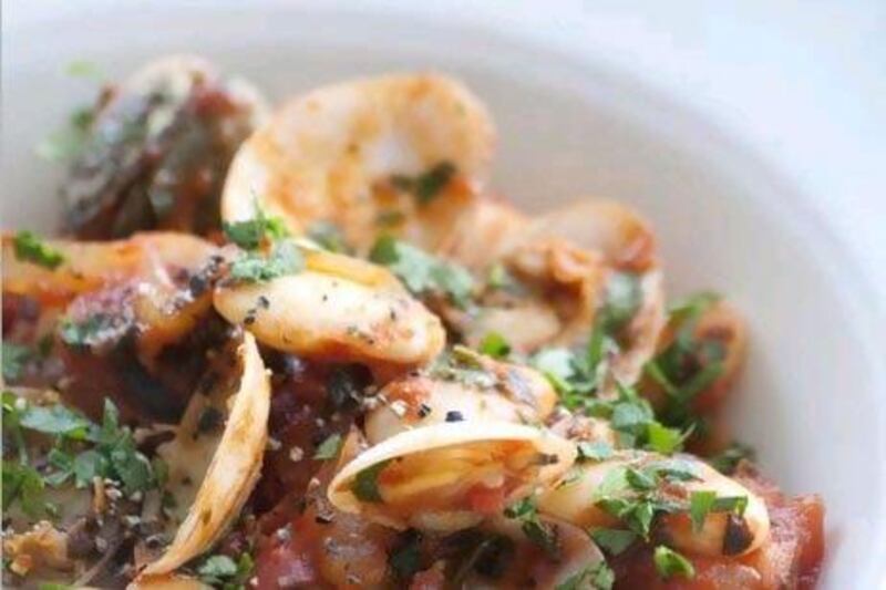 Clam and tomato stew with garlic toast.