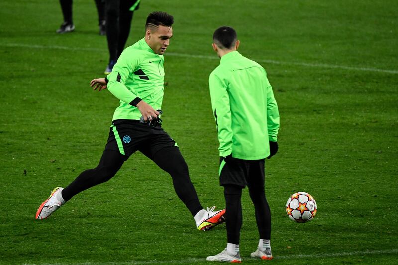 Lautaro Martinez (L) takes part in a training session in Madrid. AFP