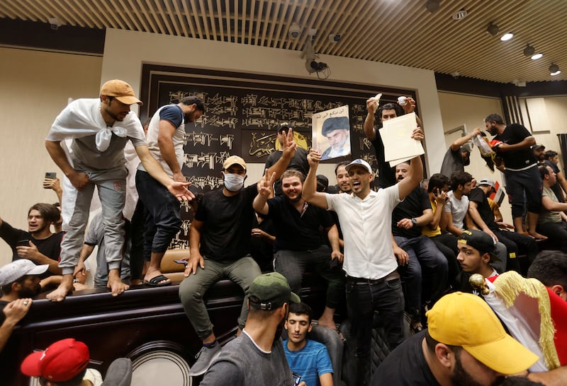 Supporters of Iraqi Shiite cleric Moqtada Al Sadr protest against corruption inside the Parliament building in Baghdad, Iraq. Reuters