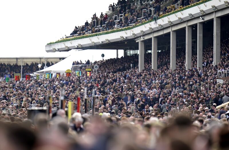 A packed stand during day one of the Cheltenham Festival. PA