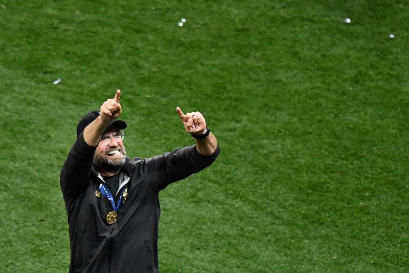 Klopp celebrates on the pitch at the final whistle. AFP