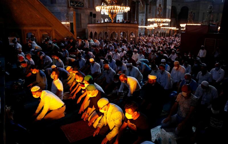 FILE PHOTO: Worshippers attend afternoon prayers and visit Hagia Sophia Grand Mosque, for the first time after it was once again declared a mosque after 86 years, in Istanbul, Turkey, July 24, 2020. REUTERS/Umit Bektas/File Photo