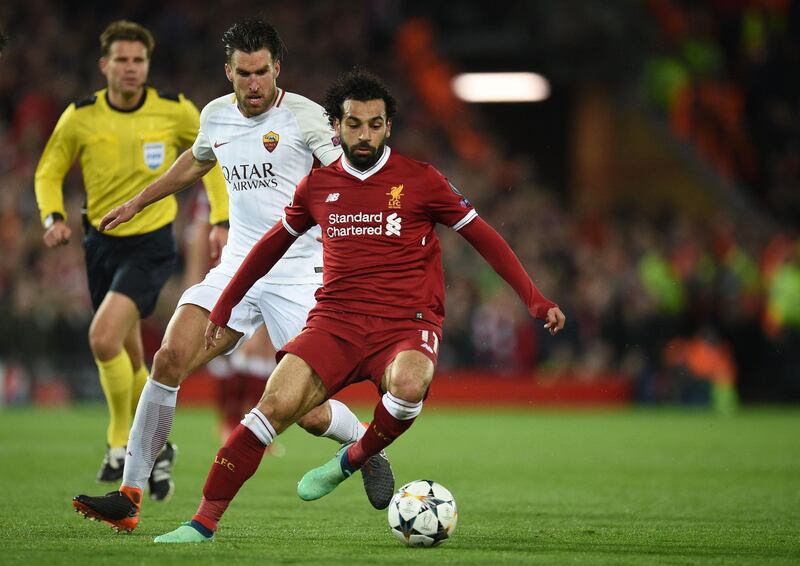 Liverpool's Mohamed Salah vies with Roma's Kevin Strootman. Oli Scarff / AFP