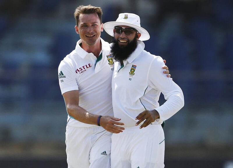 So far for South Africa's Dale Steyn, left, and captain Hashim Amla, their tour of Sri Lanka has left them all smiles. Dinuka Liyanawatte / Reuters