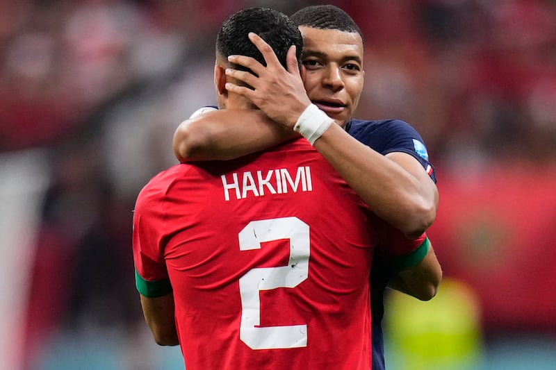 France's Kylian Mbappe hugs Morocco's Achraf Hakimi at the end of the World Cup semifinal soccer match between France and Morocco at the Al Bayt Stadium in Al Khor, Qatar, Wednesday, Dec.  14, 2022.  France won 2-0 and will play Argentina in Sunday's final.  (AP Photo / Manu Fernandez)