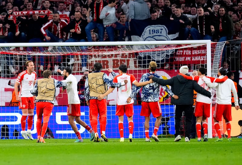 Bayern players celebrate in front of the fans after defeating Arsenal in the Champions League quarter-finals. PA