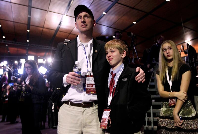 Romney supporters react as they watch voting returns at the election night rally for U.S. Republican presidential nominee Mitt Romney in Boston, Massachusetts November 6, 2012. REUTERS/Shannon Stapleton (UNITED STATES  - Tags: POLITICS ELECTIONS USA PRESIDENTIAL ELECTION)   *** Local Caption ***  BOS316_USA-CAMPAIGN_1107_11.JPG