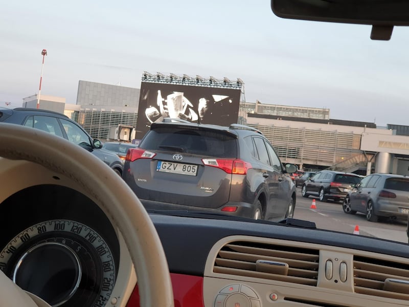 A person watches a movie from inside of a car at Vilnius International Airport, Lithuania. Reuters