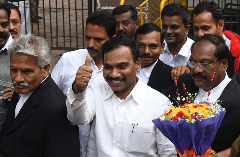 epa06401200 A. Raja (C), former telecom minister of India gestures as he comes out of a court after he was acquitted in New Delhi, India, 21 December 2017. A special court has acquitted A. Raja, a former telecom minister of India and 12 others in connection with what was dubbed as India's biggest corruption case, involving the sale of 2G mobile phone licenses in 2008. A. Raja, a key accused facing trial in the 2G spectrum case was arrested in 2011 and was jailed for more than 15 months.  EPA/STR