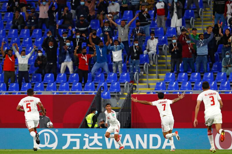 UAE players celebrate after scoring a goal.
