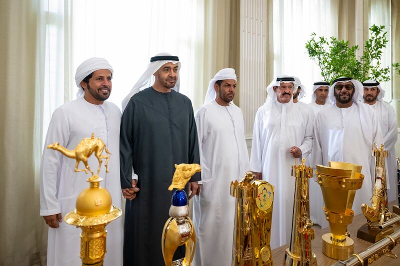President Sheikh Mohamed with members of the Presidential Camel Racing Team and Sheikh Sultan bin Hamdan bin Mohamed, Adviser to the President and Chairman of the Camel Racing Federation.