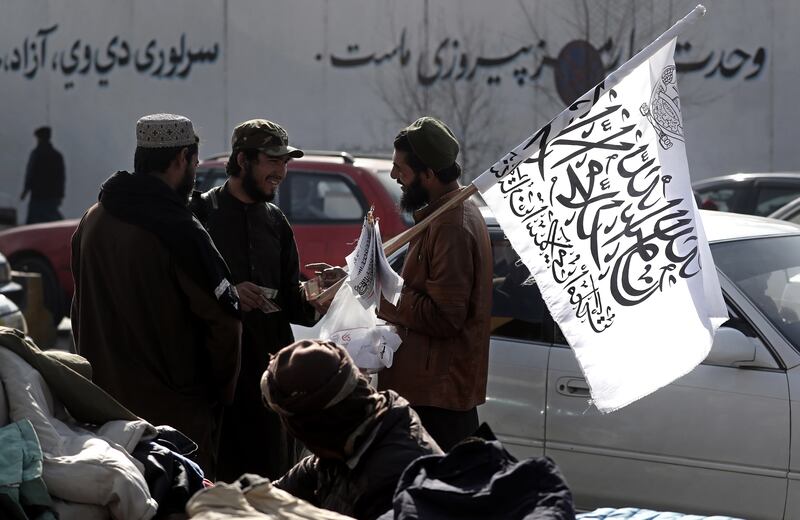 A man sells Taliban flags in downtown Kabul, Afghanistan, December 12. EPA