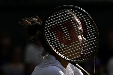 Britain's Emma Raducanu returns the ball to France's Caroline Garcia during their women's singles tennis match on the third day of the 2022 Wimbledon Championships at The All England Tennis Club in Wimbledon, southwest London, on June 29, 2022.  (Photo by SEBASTIEN BOZON  /  AFP)  /  RESTRICTED TO EDITORIAL USE